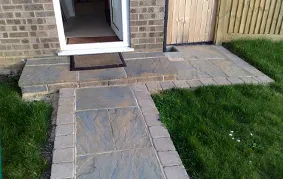 a dog door is open in a backyard